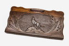 Carved beechwood backgammon board with a grey wolf and carry handle, propped open