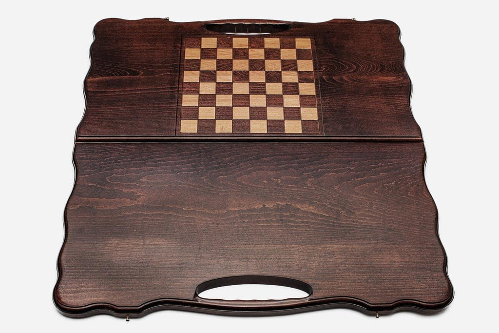The backgammon board opened to show the wooden playing surface