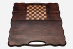 The backgammon board opened to show the wooden playing surface