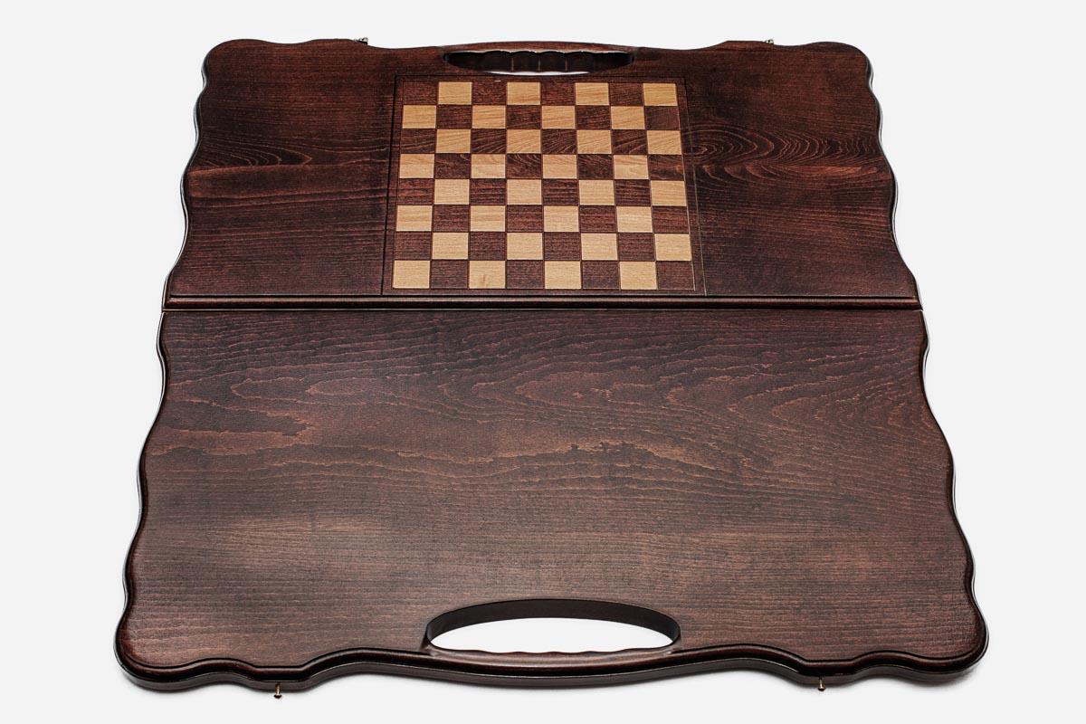 The backgammon board opened to show the wooden playing surface