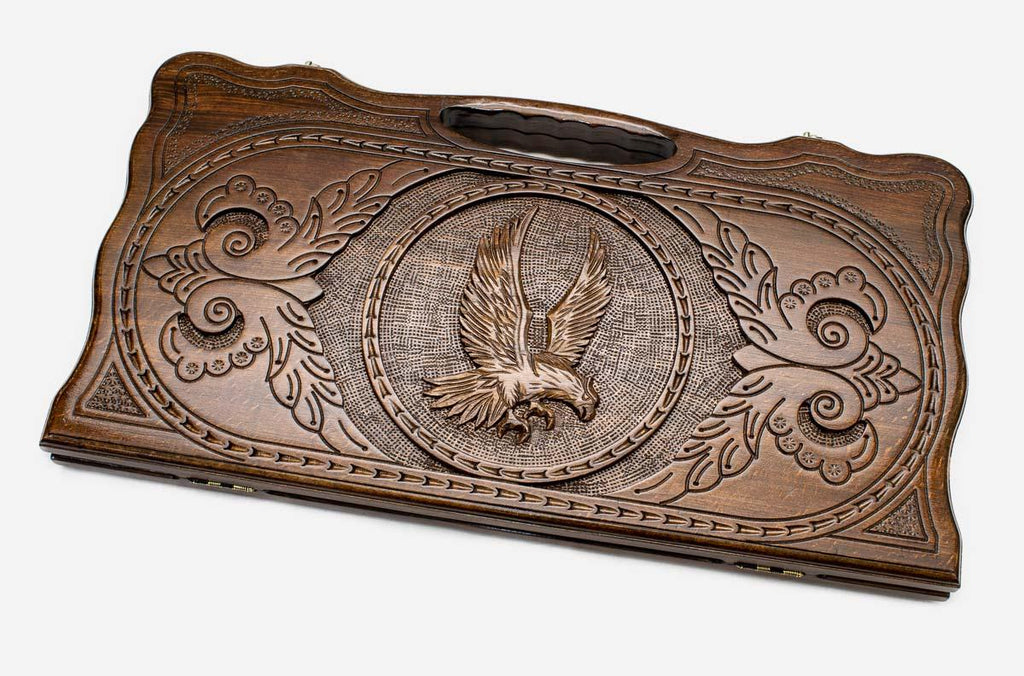 Carved beechwood backgammon board with a proud eagle and carry handle, propped open