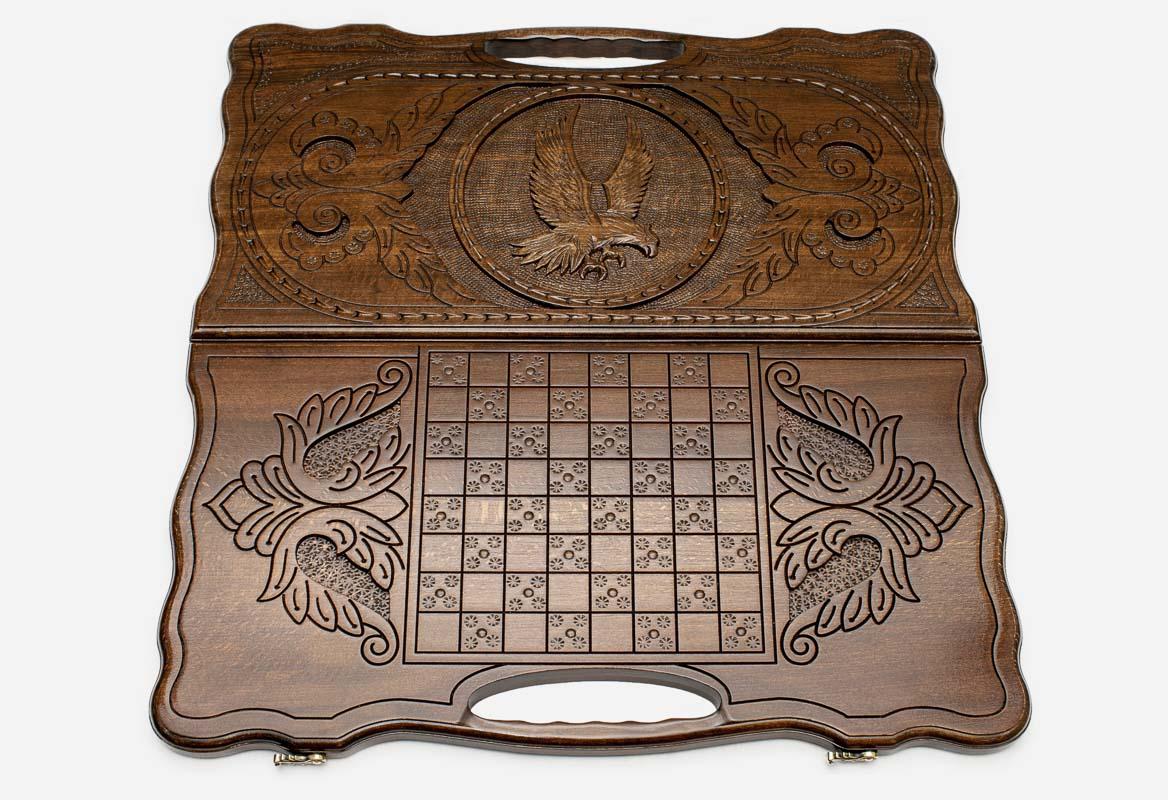 Scrollwork frame around the proud eagle carving