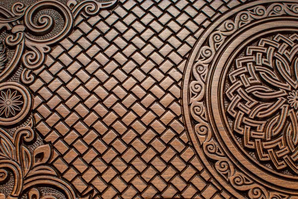 The backgammon board opened to show the wooden playing surface