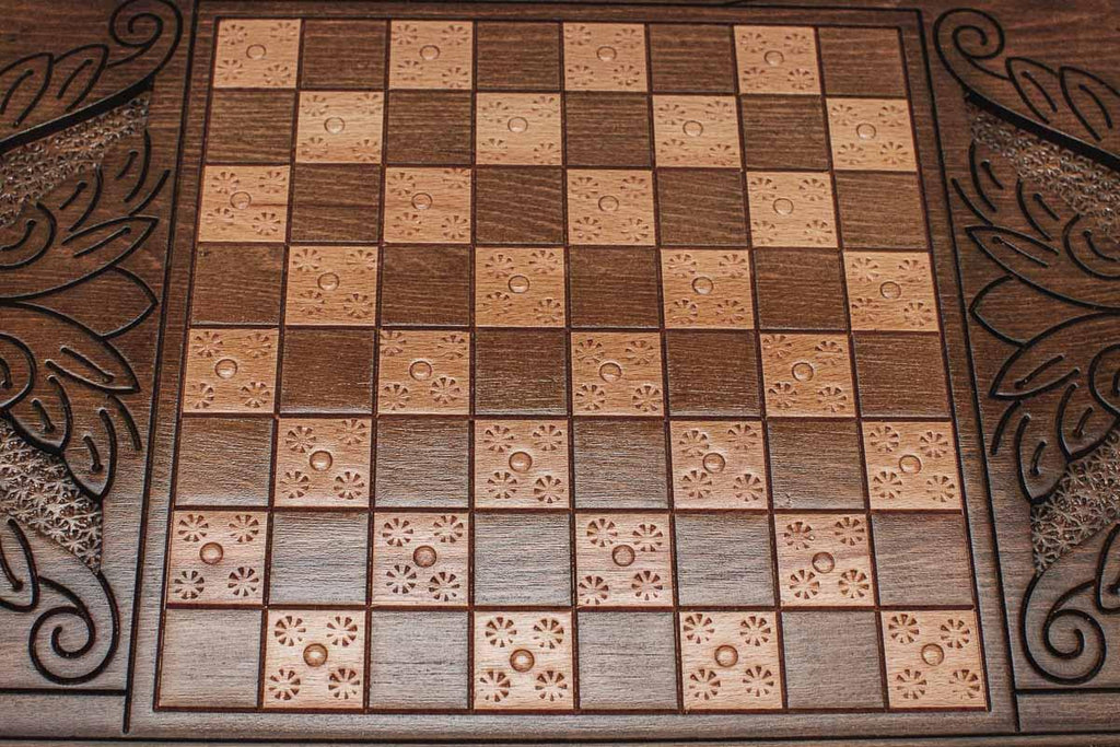 The backgammon board opened to show the wooden playing surface