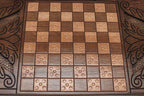 The backgammon board opened to show the wooden playing surface