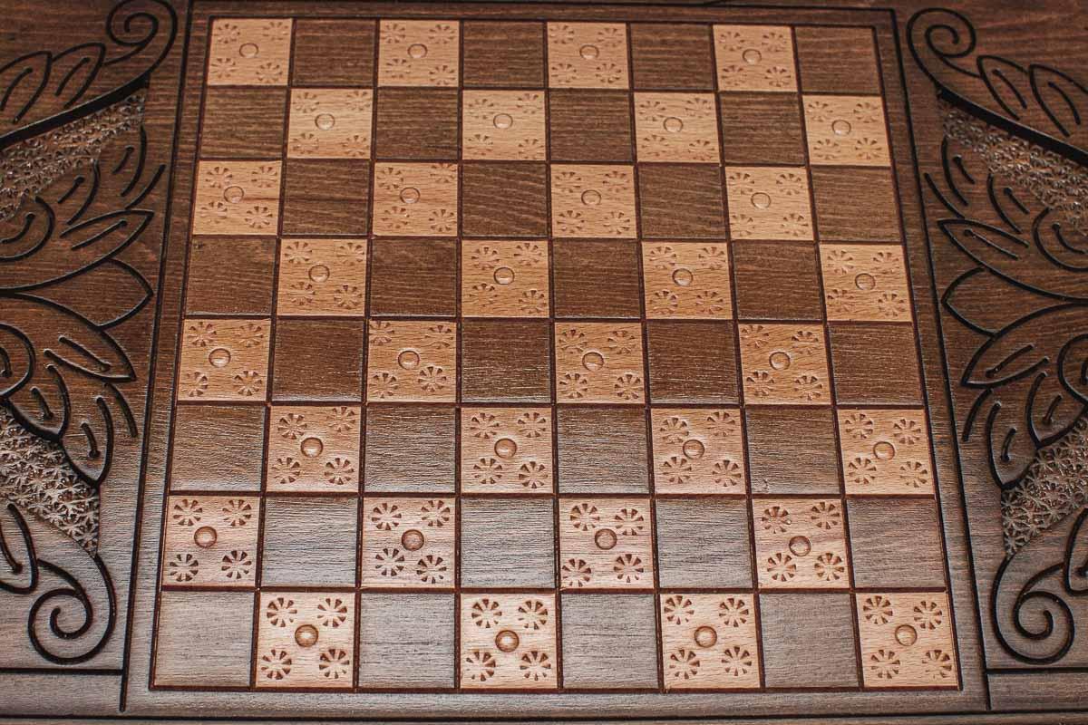 The backgammon board opened to show the wooden playing surface