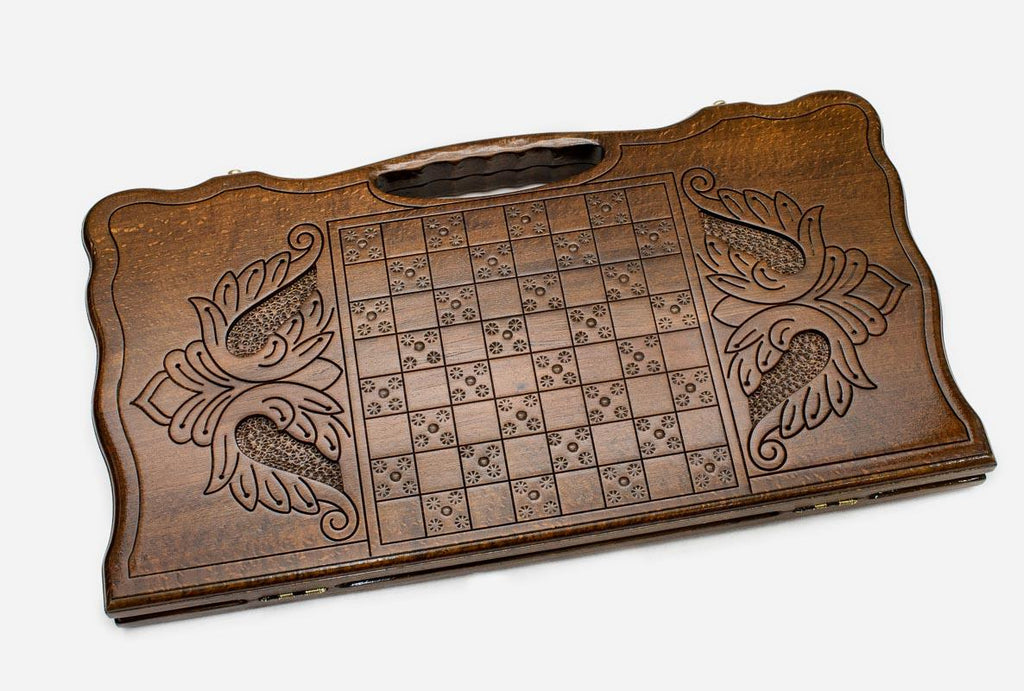 Angled view of the infinity knot carved backgammon board