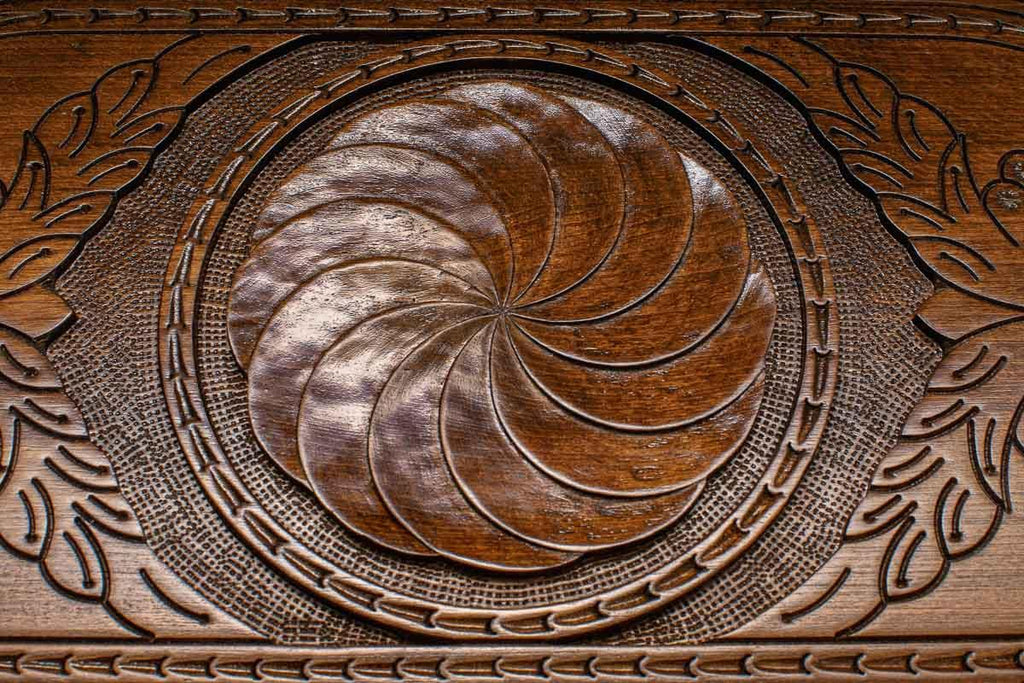The backgammon board opened to show the wooden playing surface
