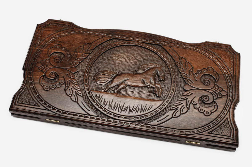 Hand-carved galloping horse on wooden backgammon set lid