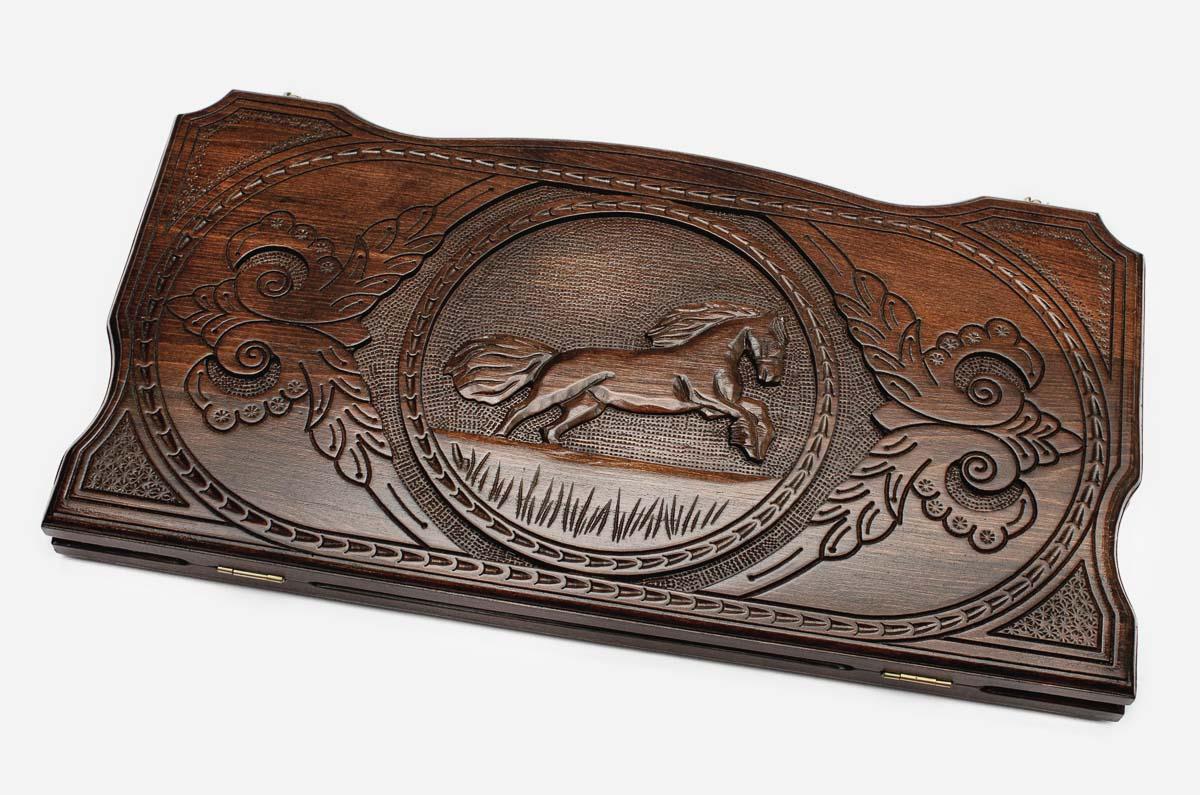 Hand-carved galloping horse on wooden backgammon set lid