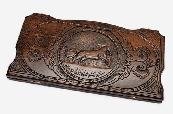 Hand-carved galloping horse on wooden backgammon set lid
