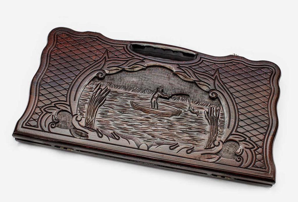 Carved beechwood backgammon board with a fisherman, propped open