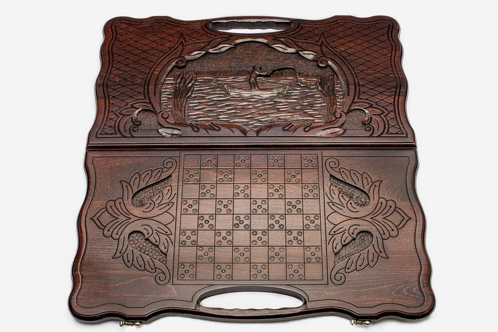 Detail of the scrollwork beside the carved fisherman