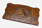 Hand-carved tall ship under full sail on wooden backgammon set