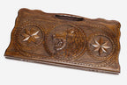 Carved beechwood backgammon board with a lion in an octagon ornament, propped open