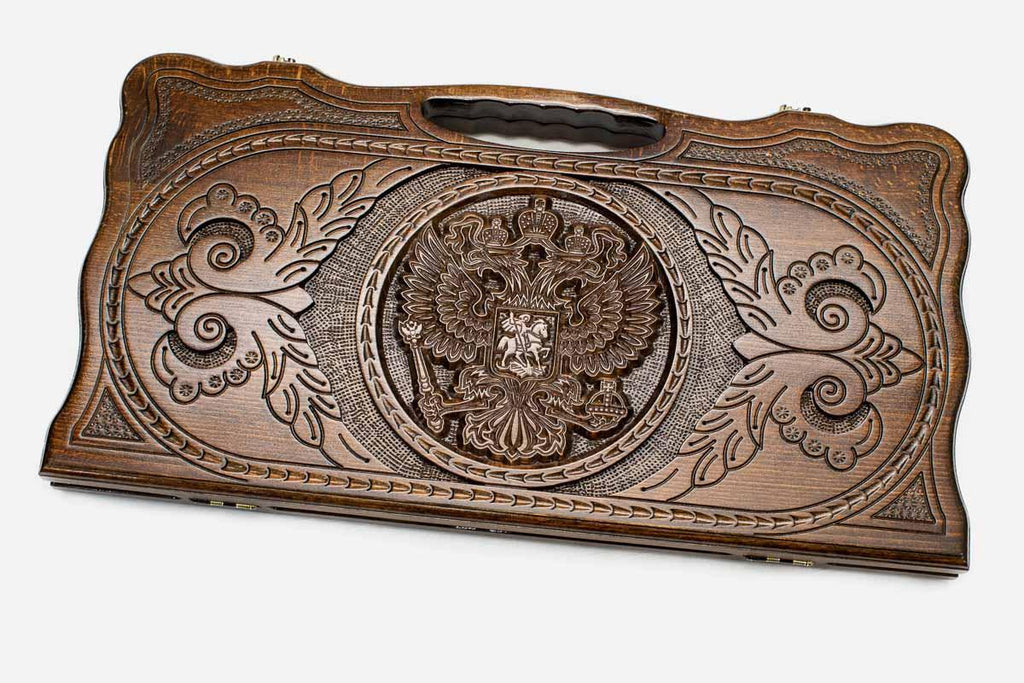 Carved beechwood backgammon board with the Russian coat of arms and a carry handle, propped open