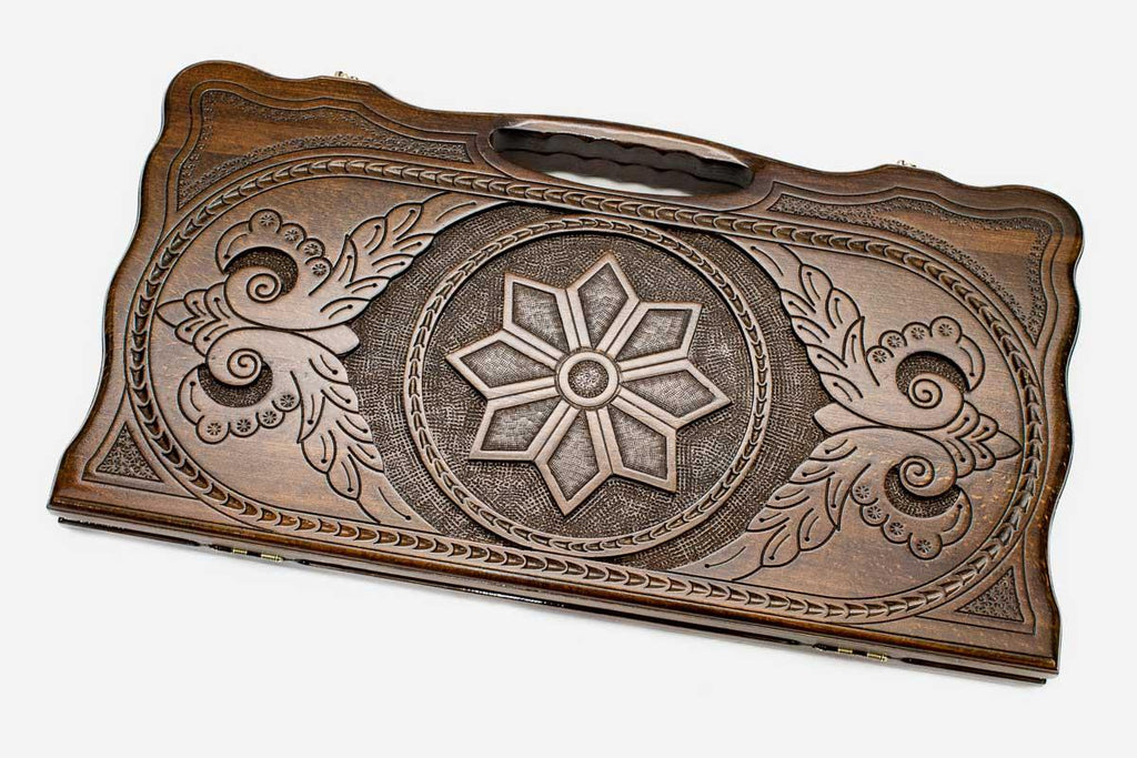 Carved beechwood backgammon board with an octagonal star ornament and a carry handle, propped open