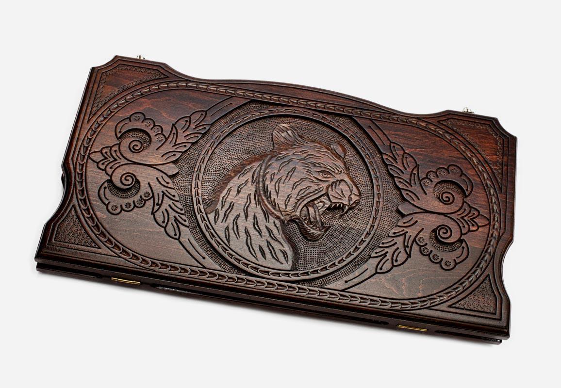 Hand-carved prowling tiger on wooden backgammon set lid