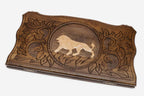 Hand-carved white lion on wooden backgammon set lid