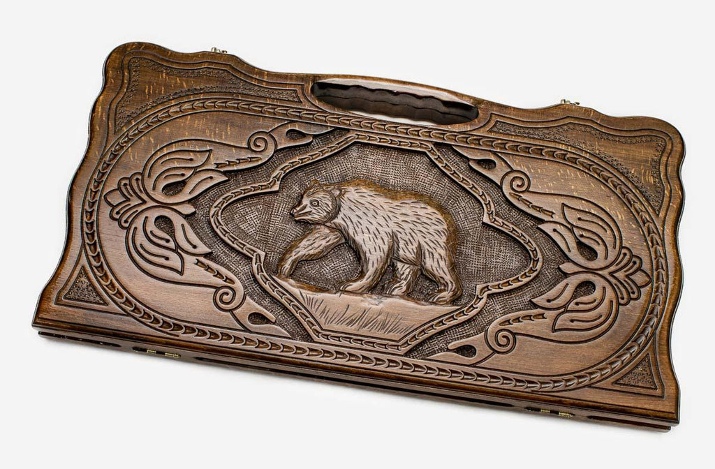 Carved beechwood backgammon board with a bold bear, propped open