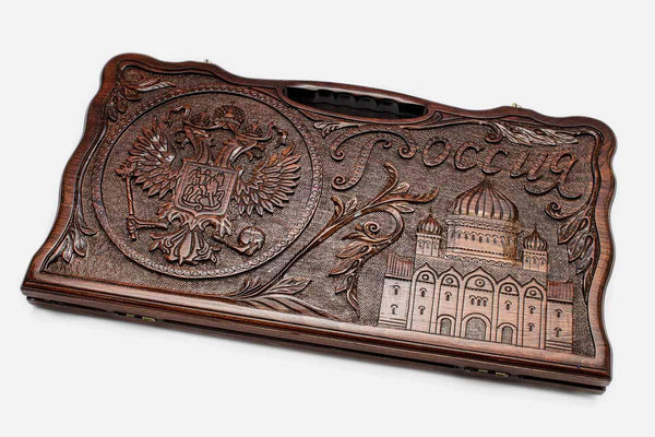Carved beechwood backgammon board with the Russian coat of arms, name and a cathedral, propped open