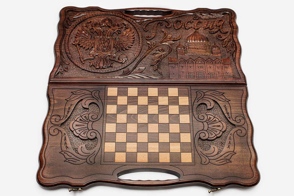 The backgammon board opened to show the wooden playing surface