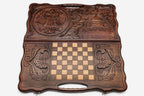 The backgammon board opened to show the wooden playing surface