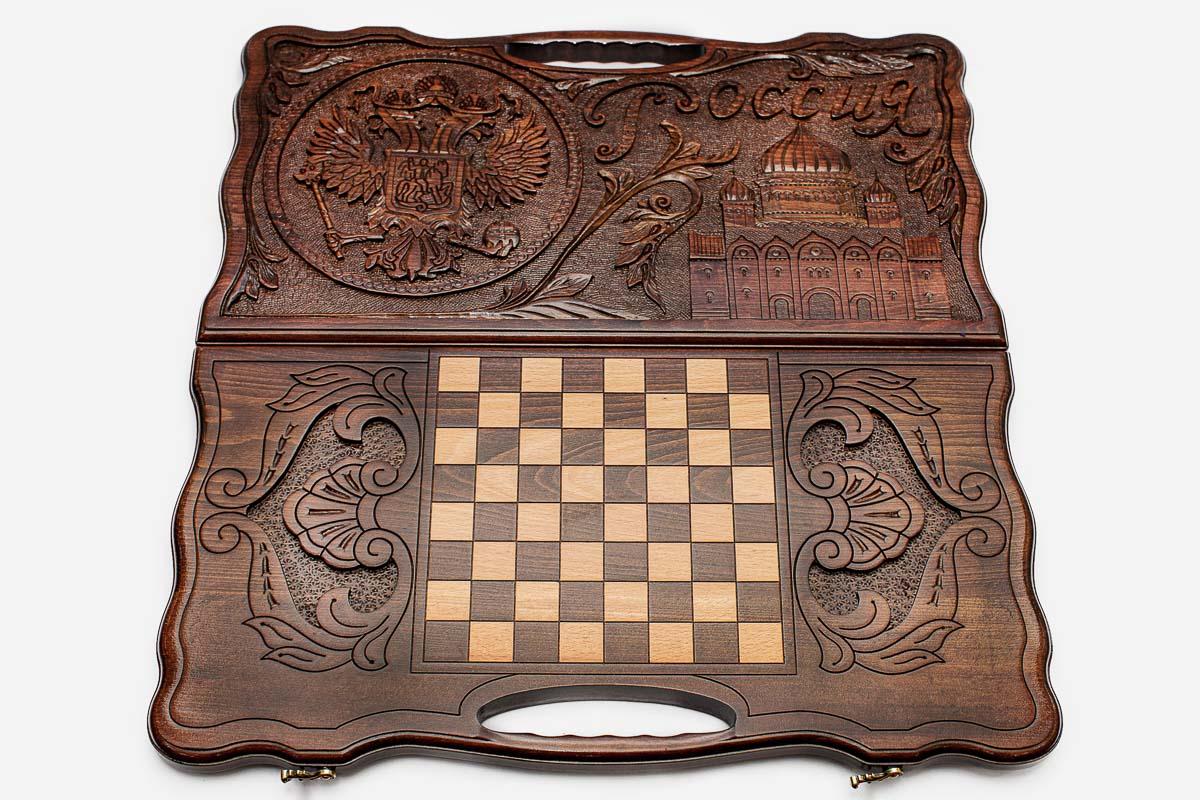 The backgammon board opened to show the wooden playing surface