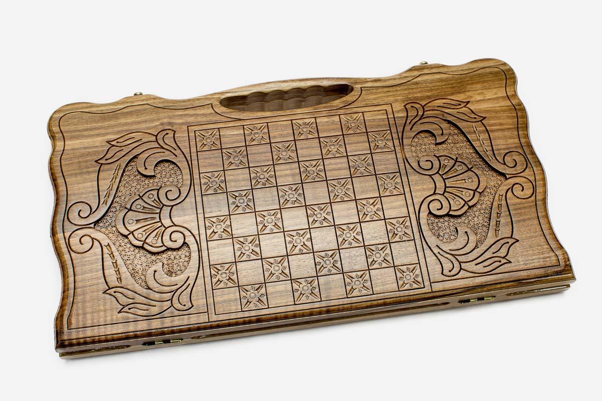 Angled view of the Vardan Mamikonyan carved walnut backgammon board