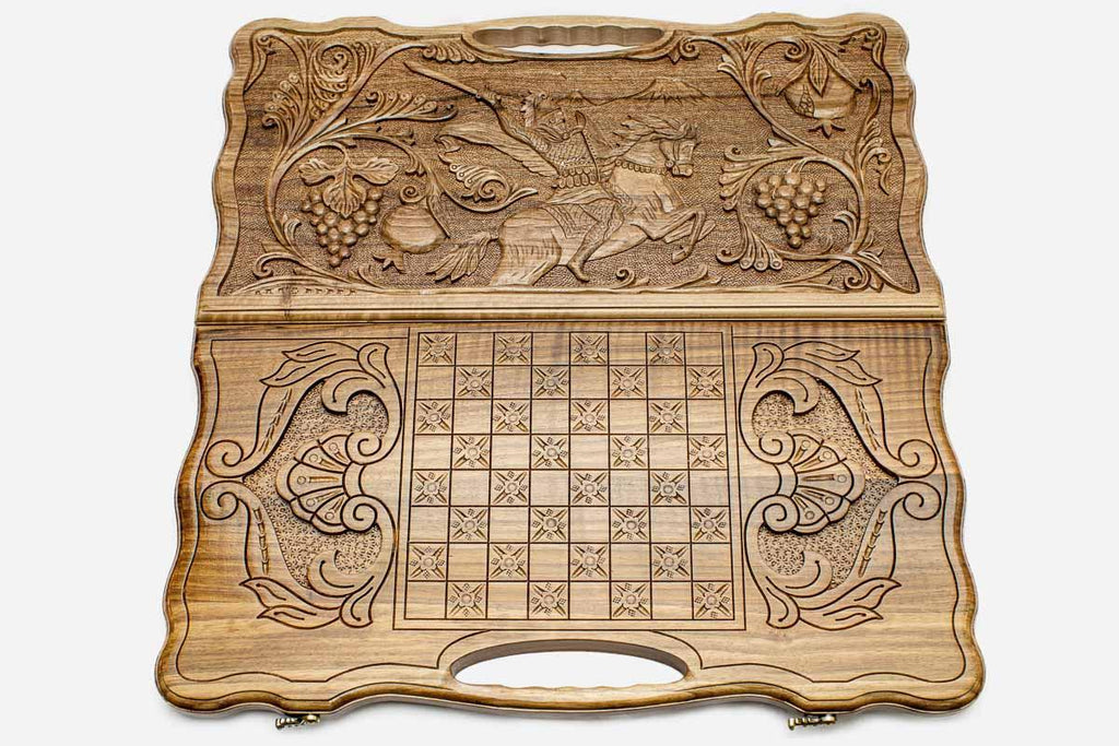 Detail of the scrollwork framing the carved hero