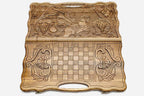 Detail of the scrollwork framing the carved hero