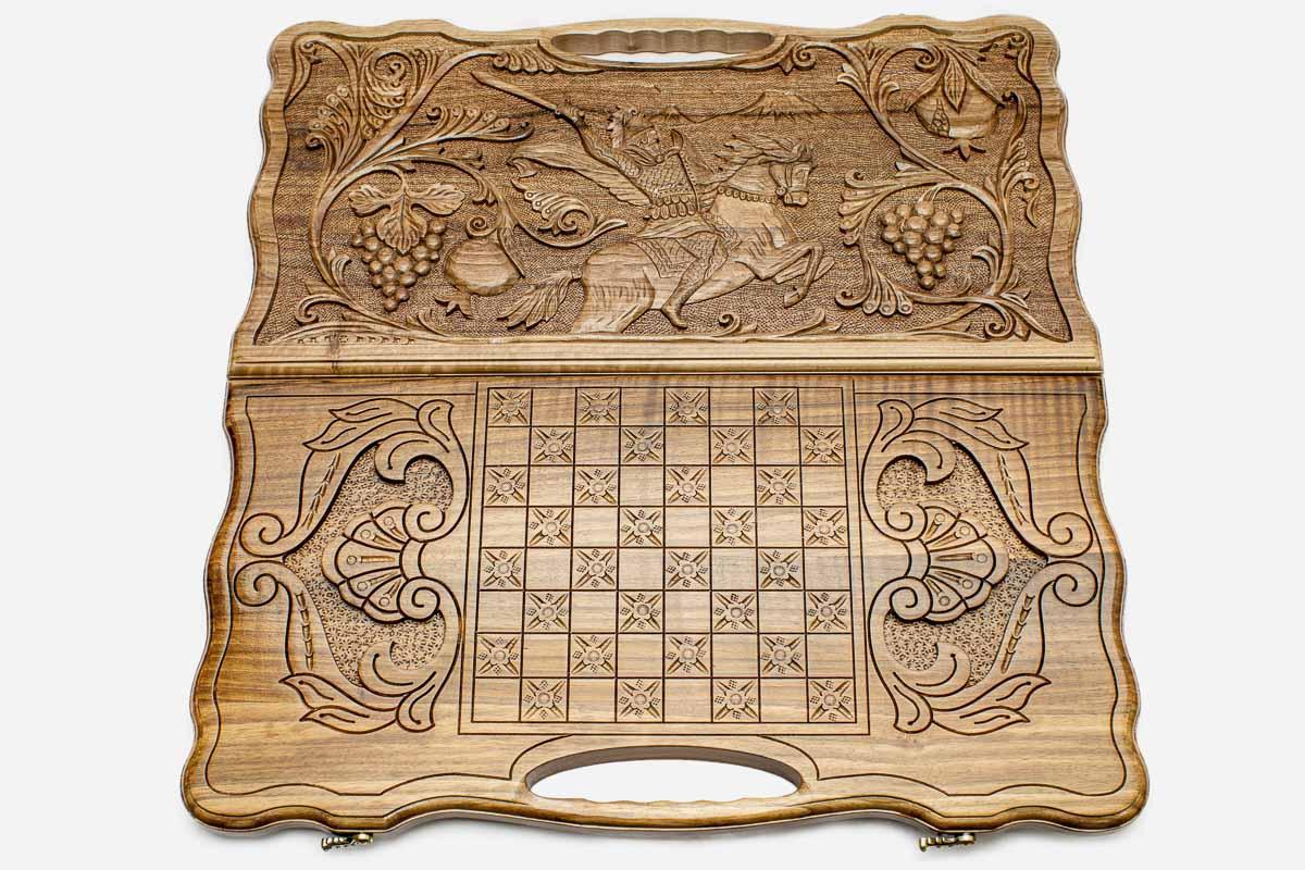 Detail of the scrollwork framing the carved hero