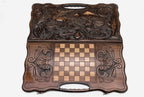 The backgammon board opened to show the wooden playing surface