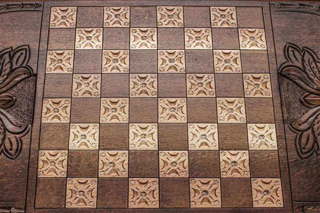 The backgammon board opened to show the wooden playing surface