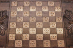 The backgammon board opened to show the wooden playing surface