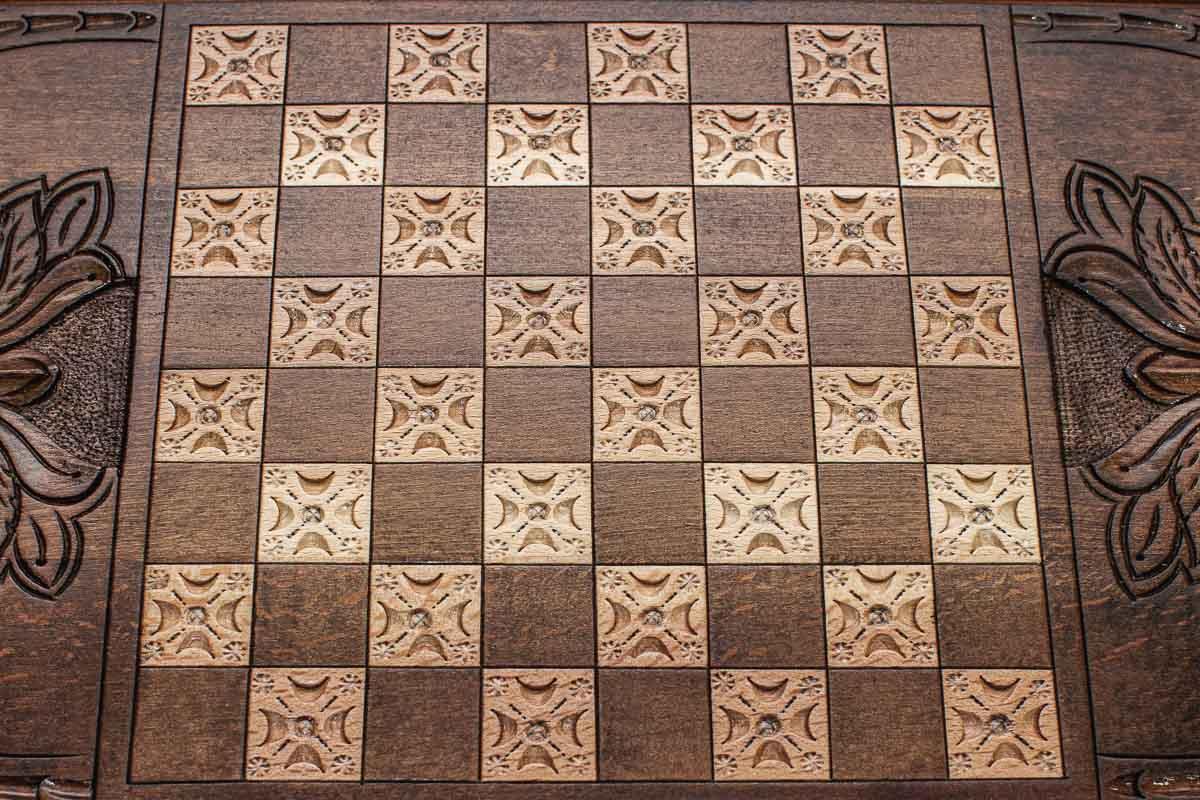 The backgammon board opened to show the wooden playing surface