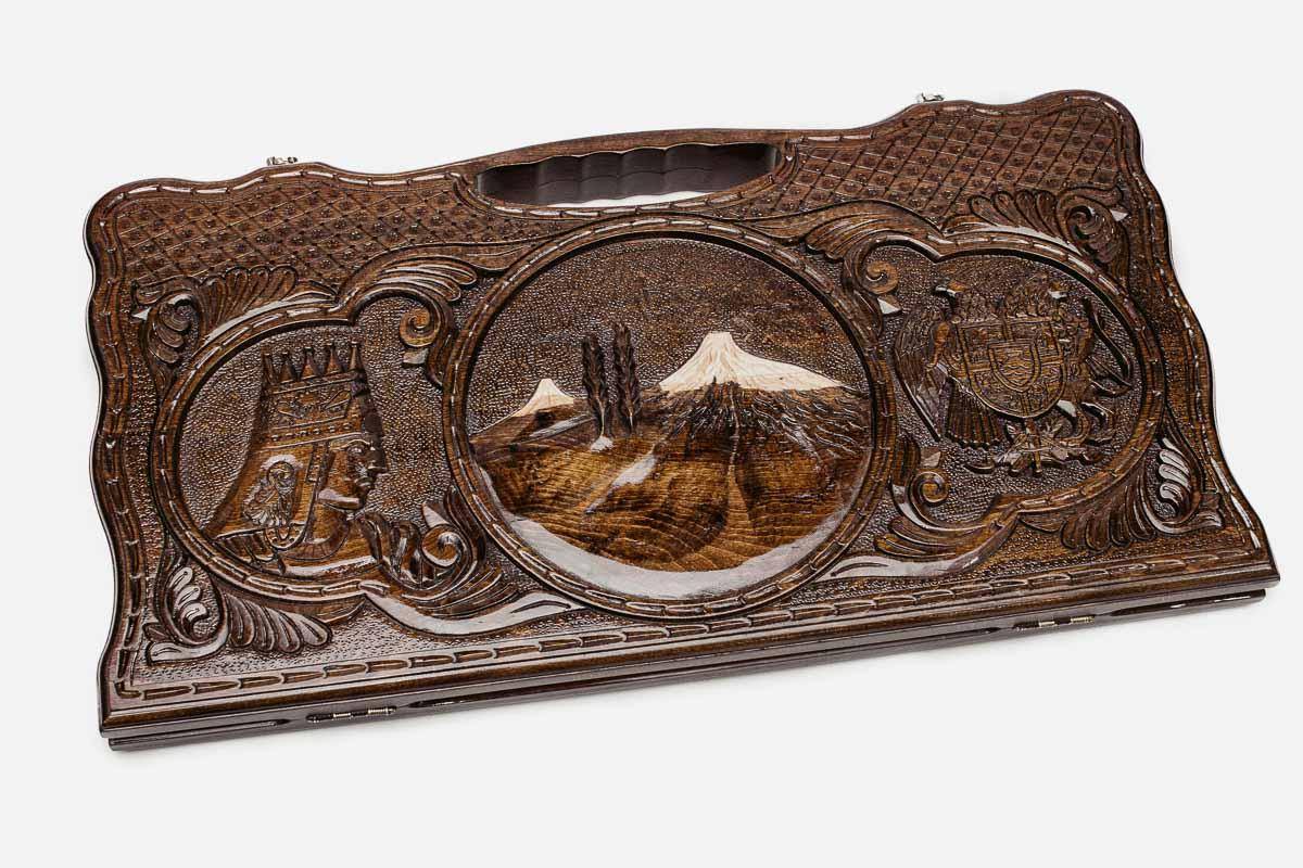 Carved beechwood backgammon board with Mount Ararat at the center and two side scenes, propped open