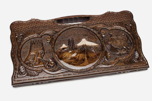 Carved beechwood backgammon board with Mount Ararat at the center and two side scenes, propped open