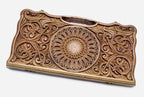 Master-carved walnut backgammon board with a blooming central ornament and scrollwork, propped open