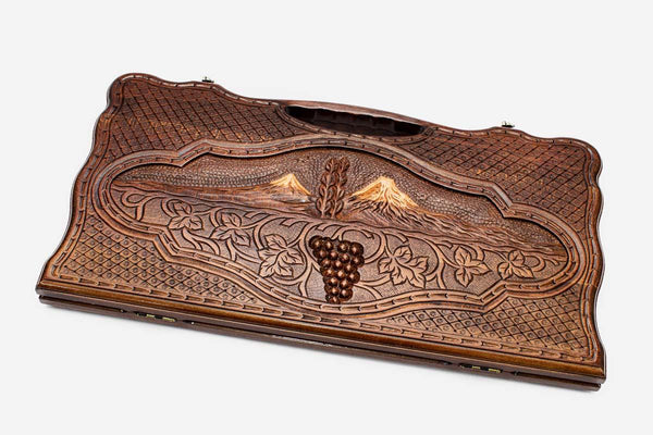 Carved beechwood backgammon board with Mount Ararat and a cluster of grapes, propped open