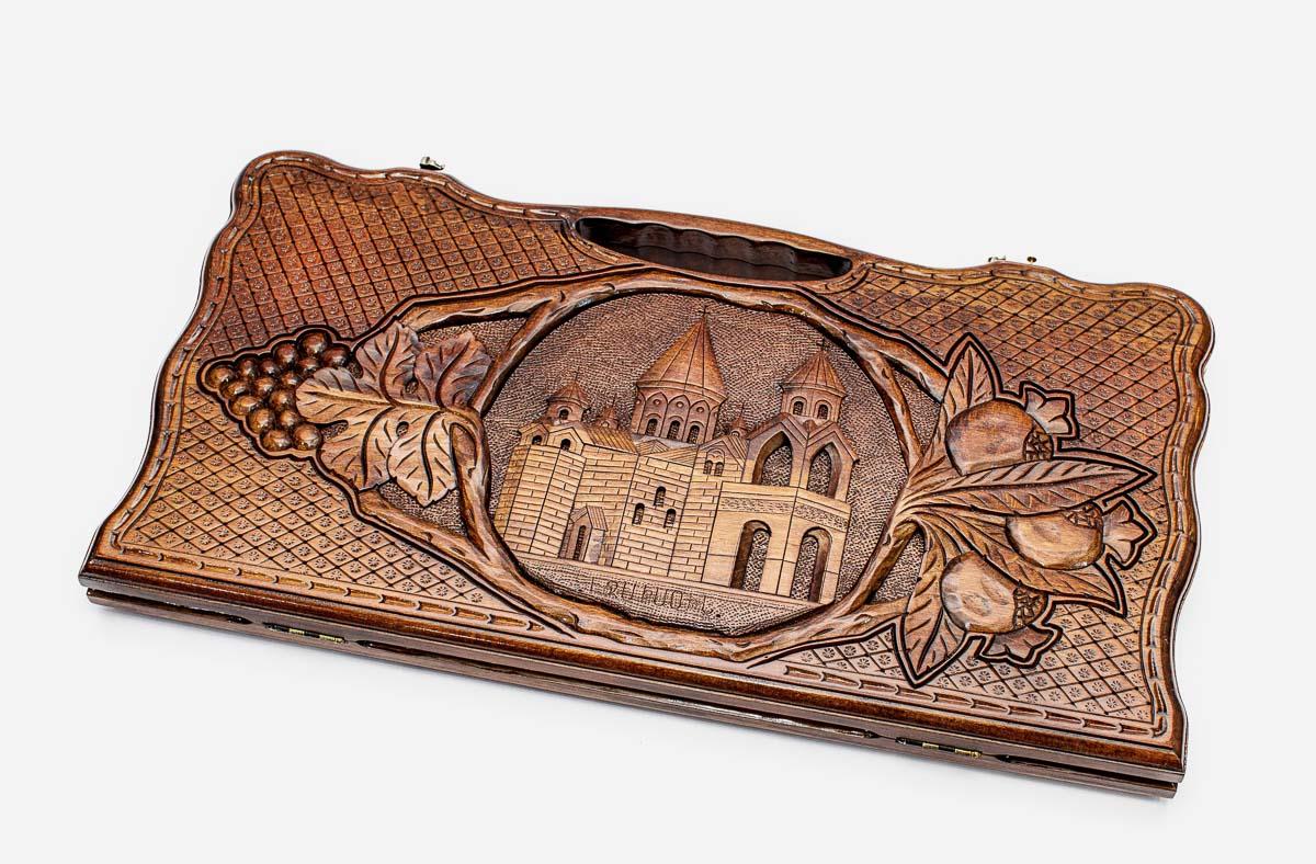 Carved beechwood backgammon board with Etchmiadzin Cathedral at the center, propped open