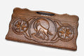 Carved beechwood backgammon board with a wolf, a lion and an octagon ornament, propped open