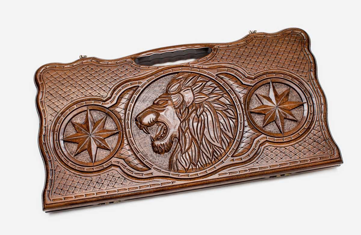 Angled view of the wolf, lion and octagon carved backgammon board