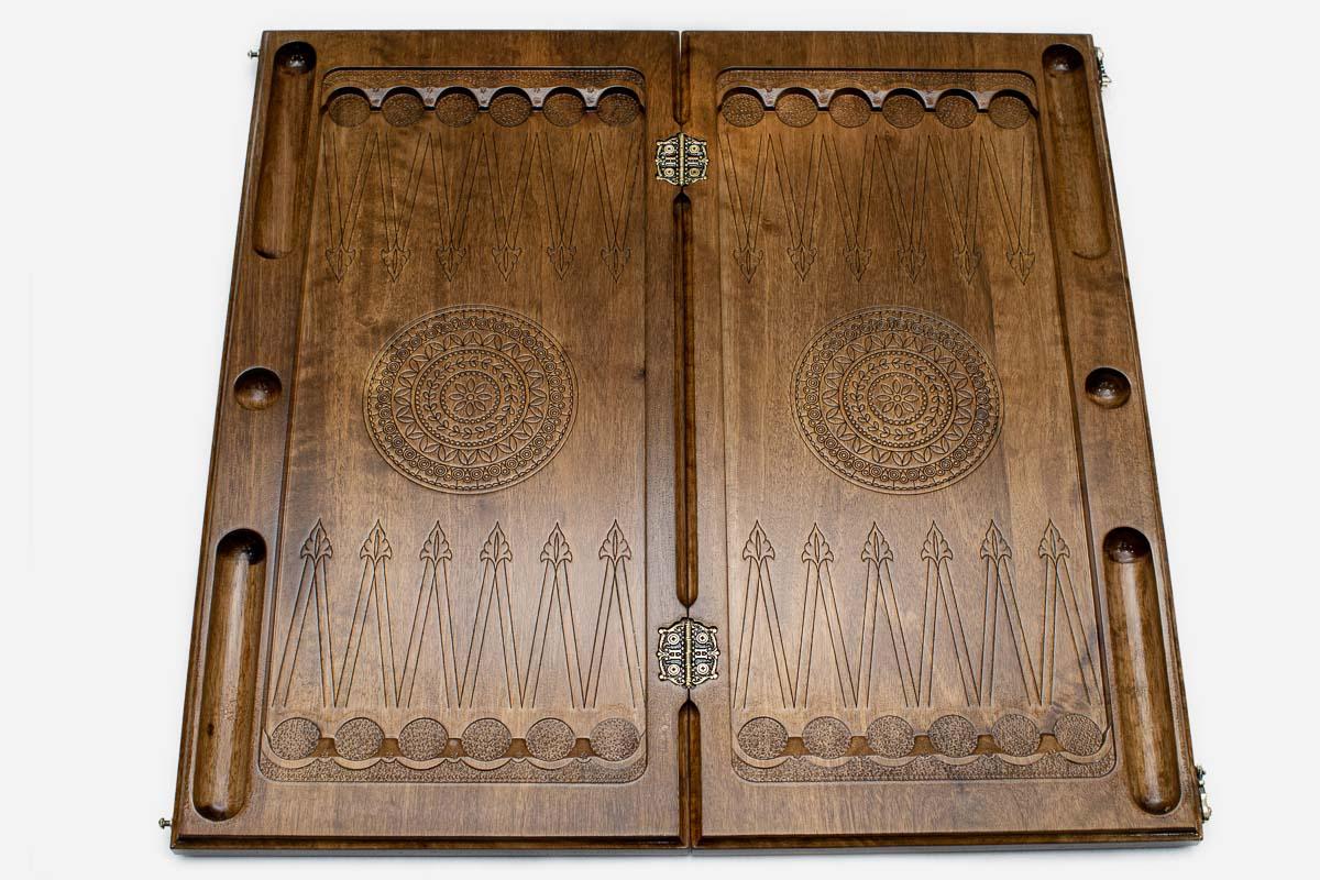 Interlaced Armenian knotwork carved in dark walnut, close view