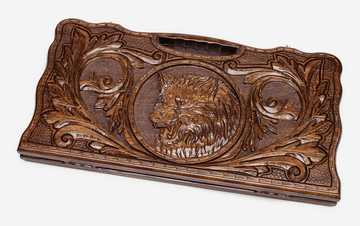 Carved beechwood backgammon board with a lone wolf and a carry handle, propped open