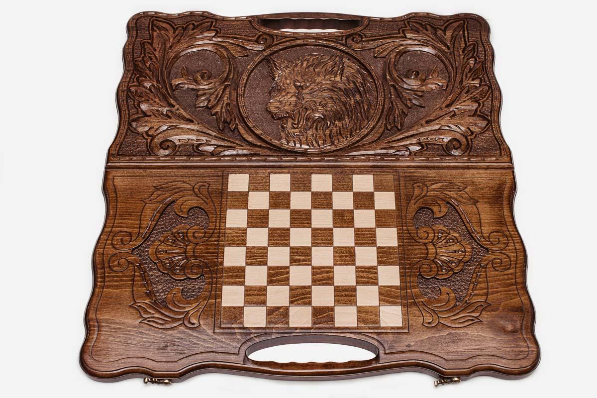 Detail of the scrollwork framing the carved wolf