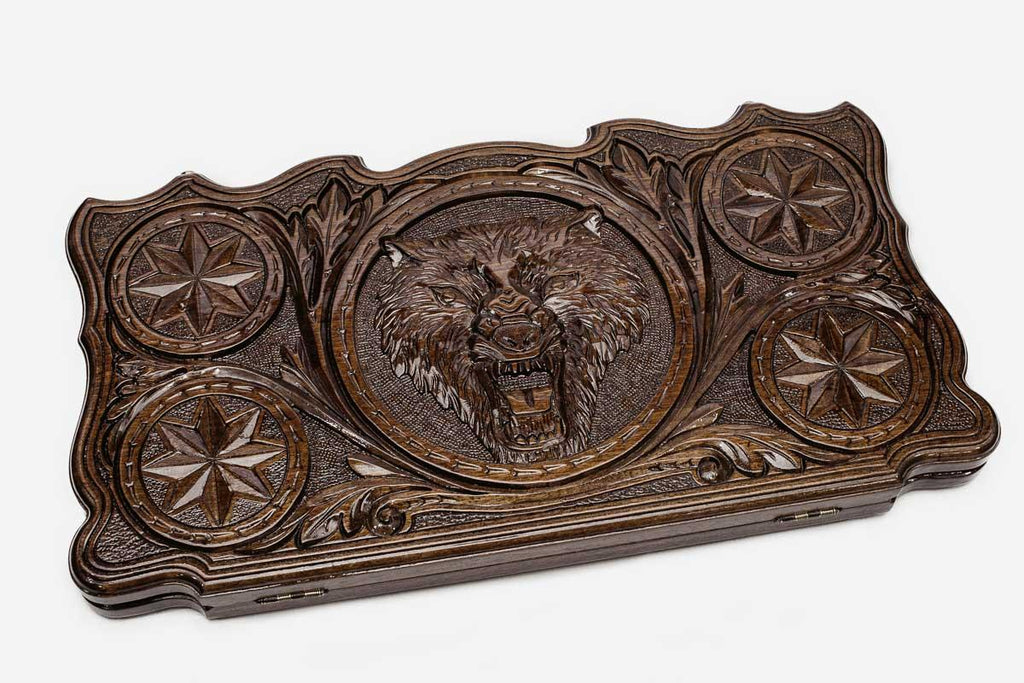Lone wolf carved on the walnut backgammon board face