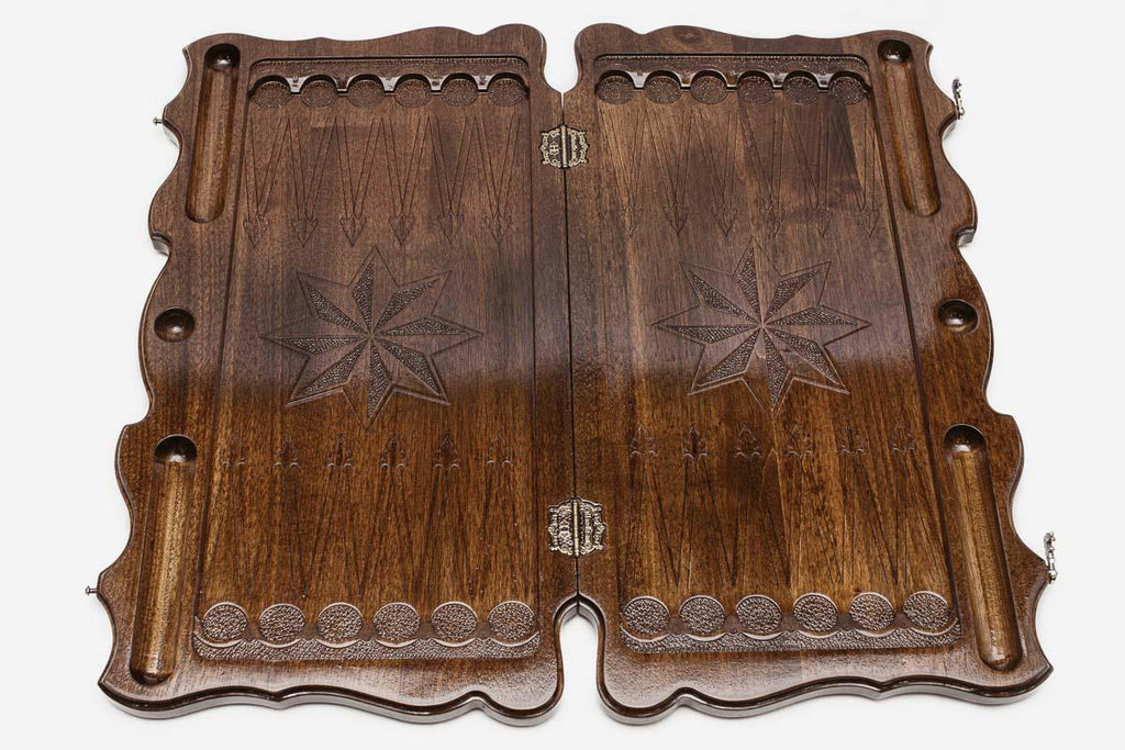 Carved octagon face of the walnut backgammon set