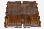 Carved octagon face of the walnut backgammon set