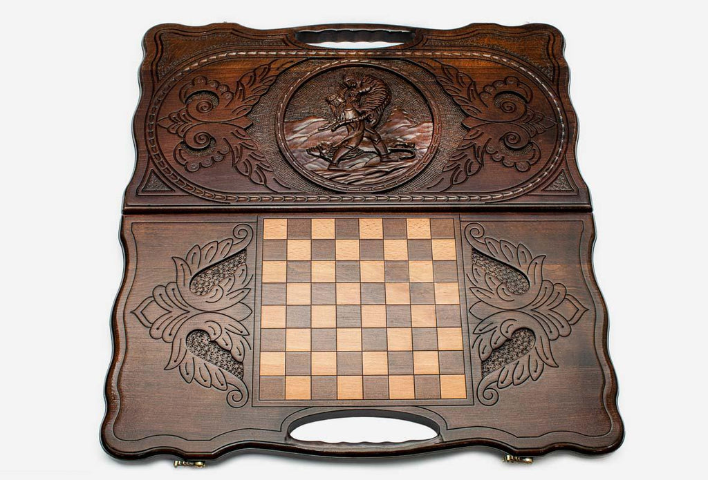The backgammon board opened to show the wooden playing surface